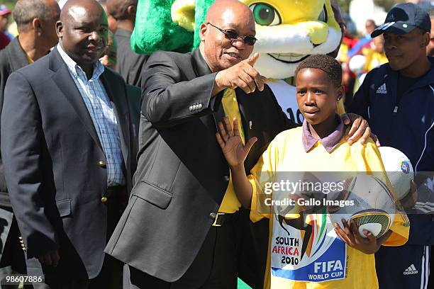 South African President Jacob Zuma chats to a young soccer player during celebrations marking the 50 Day Countdown to the start of the FIFA 2010...