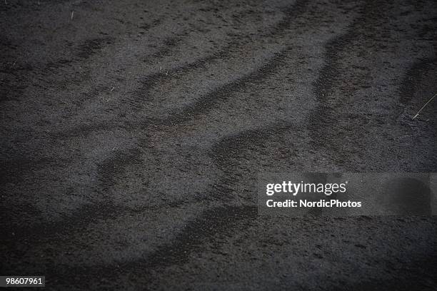 Close up of the ground which is covered by a thick layer of ash from the Eyjafjallajokull volcano, on April 21, 2010 in Skogar, Iceland. The ash is...