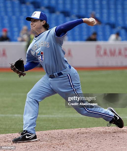 Scott Downs of the Toronto Blue Jays throws against the Kansas City Royals during a MLB game at the Rogers Centre April 21, 2010 in Toronto, Ontario,...