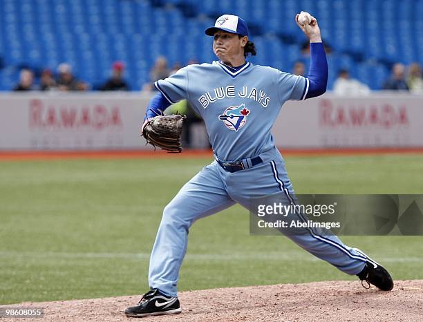 Scott Downs of the Toronto Blue Jays throws against the Kansas City Royals during a MLB game at the Rogers Centre April 21, 2010 in Toronto, Ontario,...