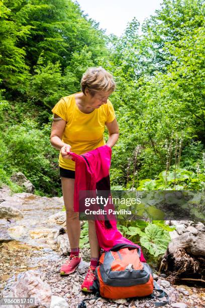 senior woman hiking in julian alps in spring, primorska, slovenia, europe - pavliha stock pictures, royalty-free photos & images