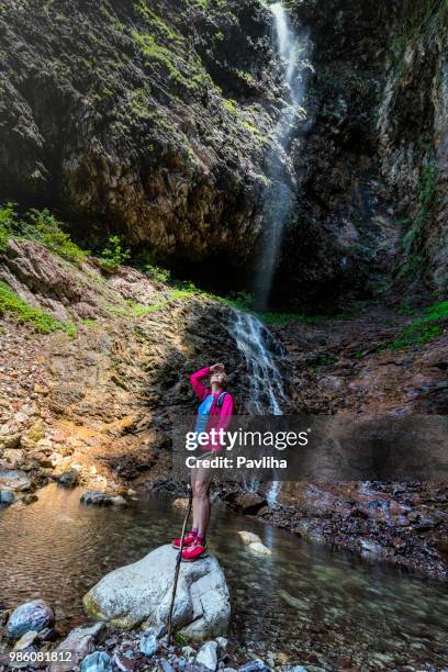 senior woman hiking in julian alps in spring, primorska, slovenia, europe - pavliha stock pictures, royalty-free photos & images