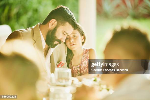 young girl embracing father during outdoor wedding reception dinner - white dinner jacket stock pictures, royalty-free photos & images