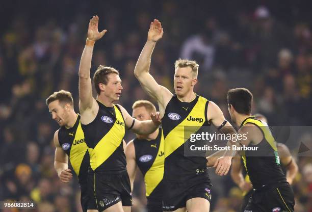 Jack Riewoldt of the Tigers celebrates after kicking a goal with Dylan Grimes of the Tigers during the round 15 AFL match between the Richmond Tigers...