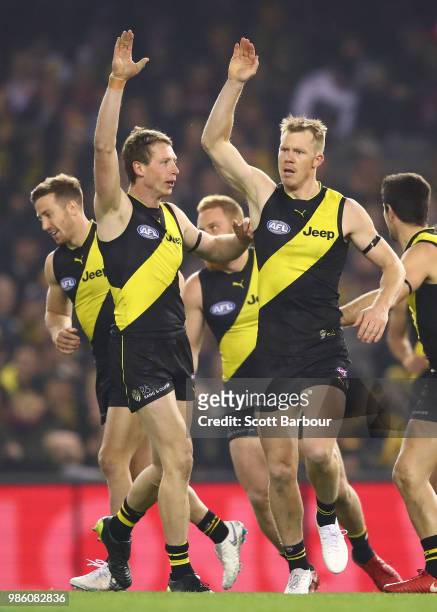 Jack Riewoldt of the Tigers celebrates after kicking a goal with Dylan Grimes of the Tigers during the round 15 AFL match between the Richmond Tigers...
