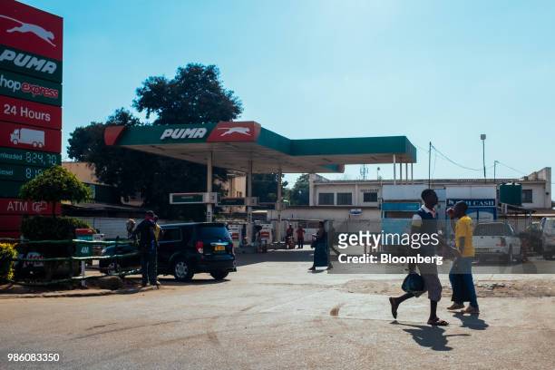 Pedestrians pass a Puma Energy Holdings Pte. Ltd. Gas station Lilongwe, Malawi, on Tuesday, June 26 2018. The diversification of the...