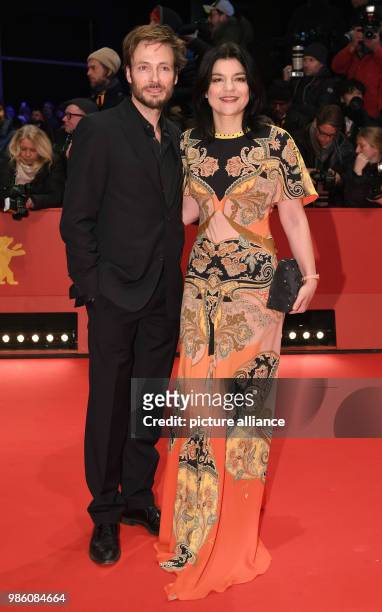Jasmin Tabatabai and Andreas Pietschmann attend the opening night of the film 'Isle of Dogs' during the Berlinale Festival in Berlin, Germany, 15...