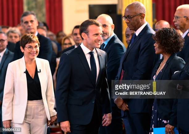French President Emmanuel Macron arrives with French Overseas Minister Annick Girardin to attend the meeting "Assises des outre-mer" at the Elysee...
