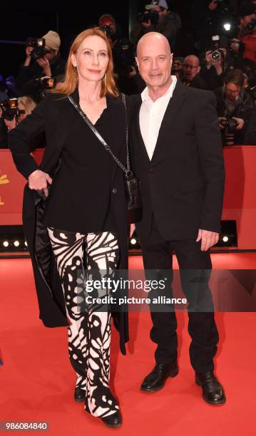 The actors Andrea Sawatzki and Christian Berkel attend the opening night of the film 'Isle of Dogs' during the Berlinale Festival in Berlin, Germany,...
