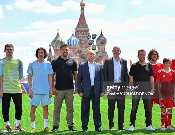 Russian President Vladimir Putin , FIFA President Gianni Infantino and Russian Football Union anti-racism and discrimination inspector Alexey Smertin...