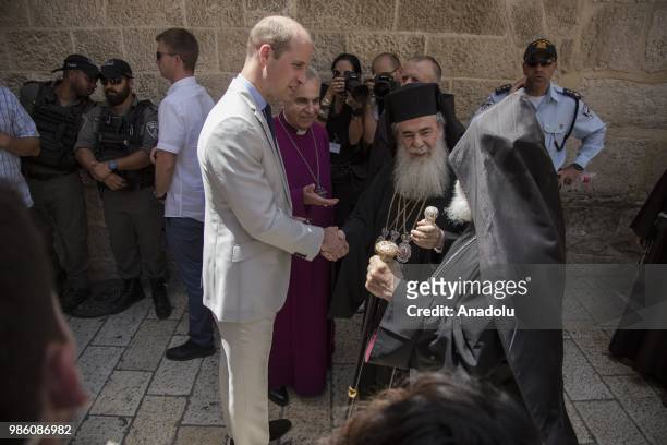 Duke of Cambridge Prince William accompanied by officials of Jerusalems Jordan-run Authority for Islamic Endowments, visits Church of the Holy...