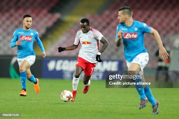 Leipzig's Bruma and Naples' Adam Ounas and Christian Maggio in action during the UEFA Europa League soccer match SSC Naples vs RB Leipzig in Naples,...