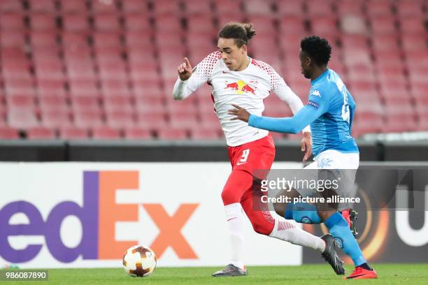 Leipzig's Yussuf Poulsen and Naples' Amadou Diawara in action during the UEFA Europa League soccer match SSC Naples vs RB Leipzig in Naples, Italy,...