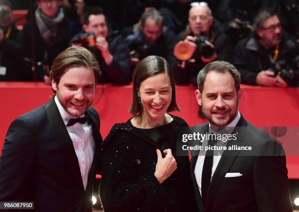 Actors Daniel Bruehl , Moritz Bleibtreu and Johanna Wokalek attend the opening night of the film 'Isle of Dogs' during the 68th Berlin international...