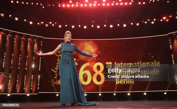 Presenter Anke Engelke stands on stage during the opening night of the film 'Isle of Dogs' during the 68th Berlin international Film Festival...