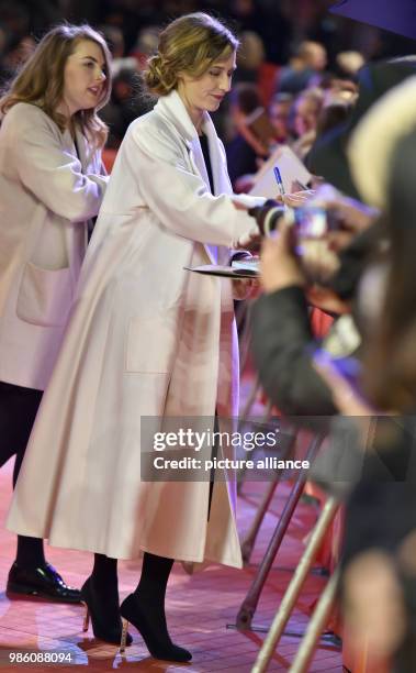 February 2018, Berlin: Berlinale, Opening, 'Isle of Dogs': Actress and Berlinale Jury member Cecile de France signs autographs. Photo: Janne...