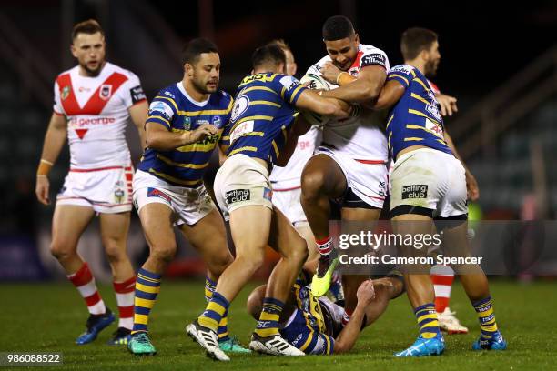 Nene Macdonald of the Dragons is tackled during the round 16 NRL match between the St George Illawarra Dragons and the Parramatta Eels at WIN Stadium...