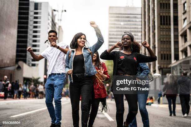 authentic group of diverse friends having fun - paulista avenue sao paulo stock pictures, royalty-free photos & images