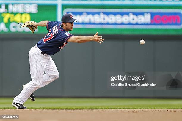 April 14: J.J. Hardy of the Minnesota Twins tosses a ball hit by the Boston Red Sox on April 14, 2010 at Target Field in Minneapolis, Minnesota. The...