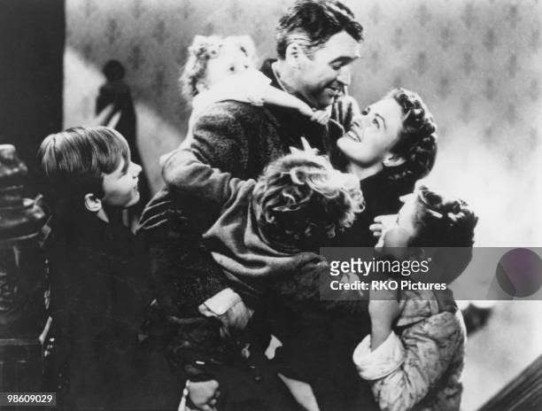 American actors James Stewart and Donna Reed star in the film 'It's a Wonderful Life', 1946. The children are Jimmy Hawkins , Karolyn Grimes , Larry...