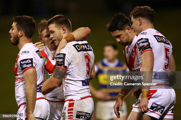 Euan Aitken of the Dragons is congratulated by team mates after scoring a try during the round 16 NRL match between the St George Illawarra Dragons...