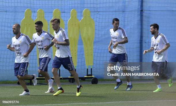Argentina's footballers Javier Mascherano, Ever Banega, Lucas Biglia, Angel Di Maria and Lionel Messi jog during a training session at the team's...