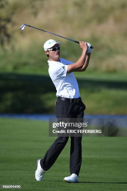 Chinese golfer Li Haotong competes in the HNA Open de France, as part of the European Tour 2018, at the Saint-Quentin-en-Yvelines national golf...