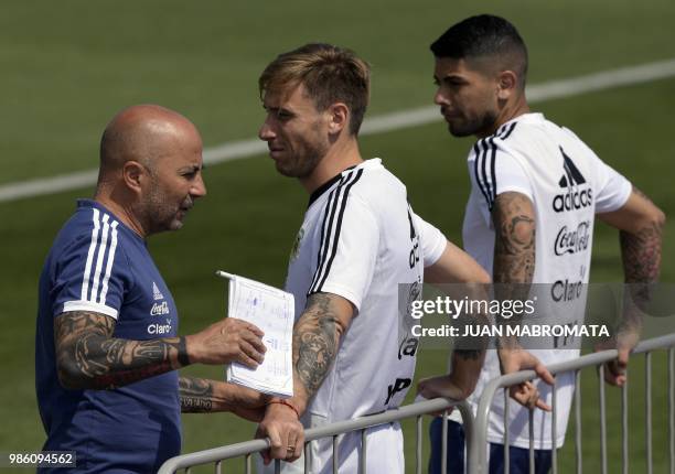 Argentina's coach Jorge Sampaoli , midfielder Lucas Biglia and midfielder Ever Banega attend a training session at the team's base camp in Bronnitsy,...