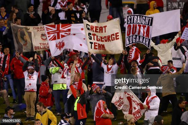 Dragons fans celebrate a try during the round 16 NRL match between the St George Illawarra Dragons and the Parramatta Eels at WIN Stadium on June 28,...