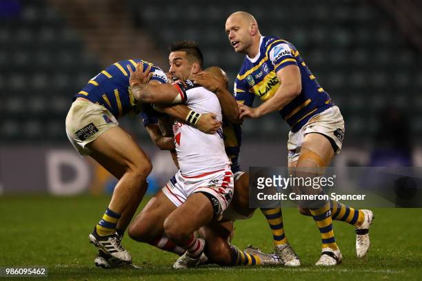 Paul Vaughan of the Dragons is tackled during the round 16 NRL match between the St George Illawarra Dragons and the Parramatta Eels at WIN Stadium...