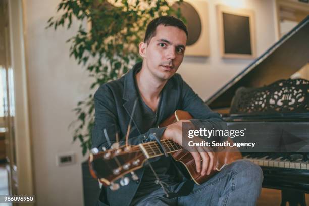 young guitarist - soloist stock pictures, royalty-free photos & images