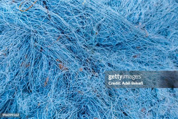 blue fishing net - commercial fishing net stock pictures, royalty-free photos & images