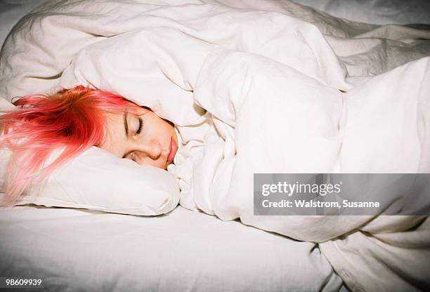 young woman sleeping, sweden. - bad hair day stock pictures, royalty-free photos & images