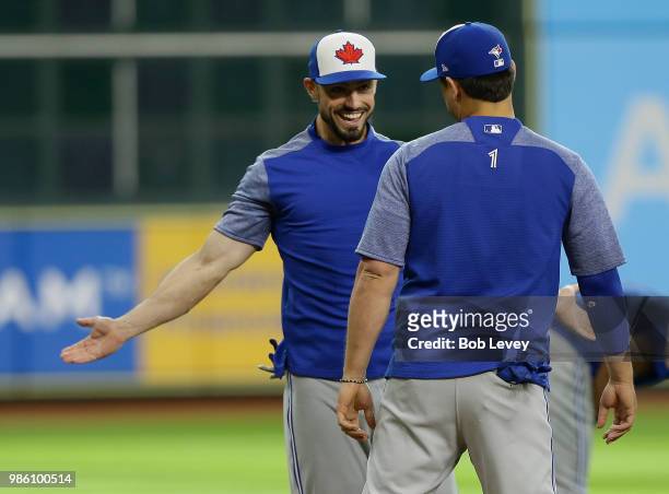 Randal Grichuk of the Toronto Blue Jays and Aledmys Diaz during batting practice at Minute Maid Park on June 25, 2018 in Houston, Texas.