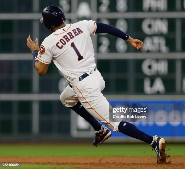 Carlos Correa of the Houston Astros rounds second base against the Toronto Blue Jays at Minute Maid Park on June 25, 2018 in Houston, Texas.