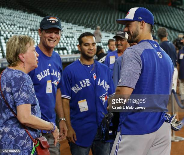 Randal Grichuk of the Toronto Blue Jays talks with family members before batting practice at Minute Maid Park on June 25, 2018 in Houston, Texas.