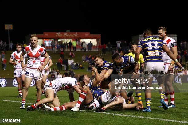 Jarryd Hayne of the Eels scores a try during the round 16 NRL match between the St George Illawarra Dragons and the Parramatta Eels at WIN Stadium on...