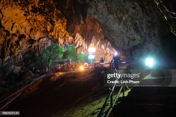 Rescuers install a water pump inside Tham Luang Nang Non cave on June 28, 2018 in Chiang Rai, Thailand. Rescuers battle heavy rain in northern...