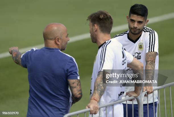 Argentina's midfielder Ever Banega , midfielder Lucas Biglia and coach Jorge Sampaoli attend a training session at the team's base camp in Bronnitsy,...