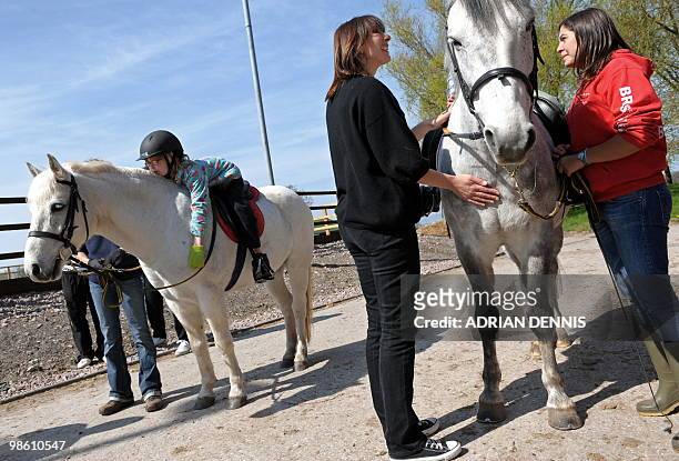 Samantha Cameron , wife of British opposition Conservative party leader David Cameron, pats a horse during an election campaign visit to The Avon...