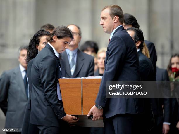 Spain's tennis player Rafael Nadal and Barcelona's handball player David Barrufet carry the coffin of former International Olympic Committee...