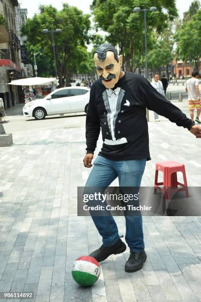 Man dressed up as Vicente Fox of The Mafia of Power team controls the ball during the protest match between Mafia del Poder and Morena Party at...