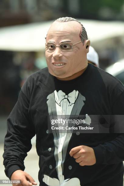 Man dressed up as Felipe Claderon of The Mafia of Power team poses during the protest match between Mafia del Poder and Morena Party at Alameda...