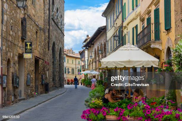 montalcino,main street - patio umbrella stock pictures, royalty-free photos & images