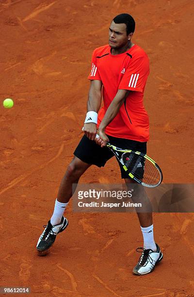 Jo-Wilfried Tsonga of France plays a double handed backhand to Nicolas Almagro of Spain on day four of the ATP 500 World Tour Barcelona Open Banco...