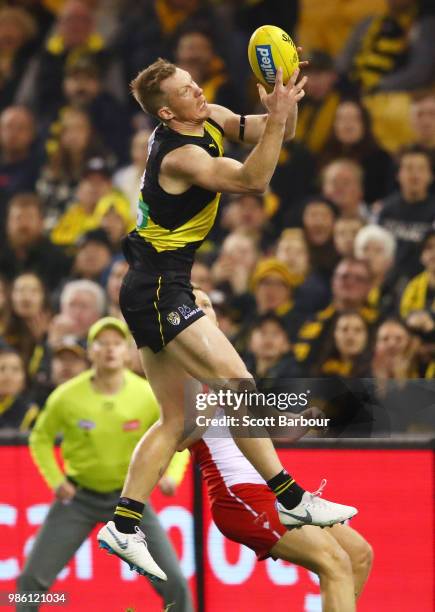 Jack Riewoldt of the Tigers marks the ball during the round 15 AFL match between the Richmond Tigers and the Sydney Swans at Etihad Stadium on June...