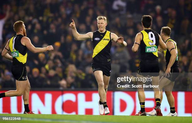 Jack Riewoldt of the Tigers celebrates after kicking a goal during the round 15 AFL match between the Richmond Tigers and the Sydney Swans at Etihad...