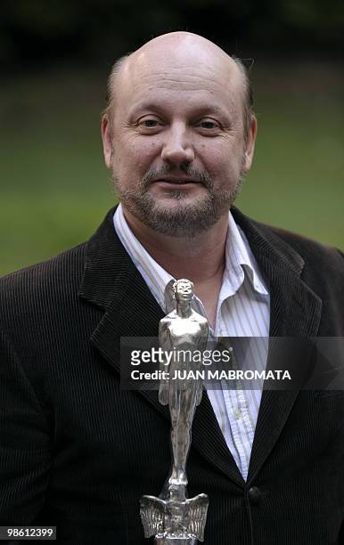 Argentine film director Juan Jose Campanella poses with the Ariel Iberoamericano award for Argentine film "El secreto de sus ojos" given by Mexican...