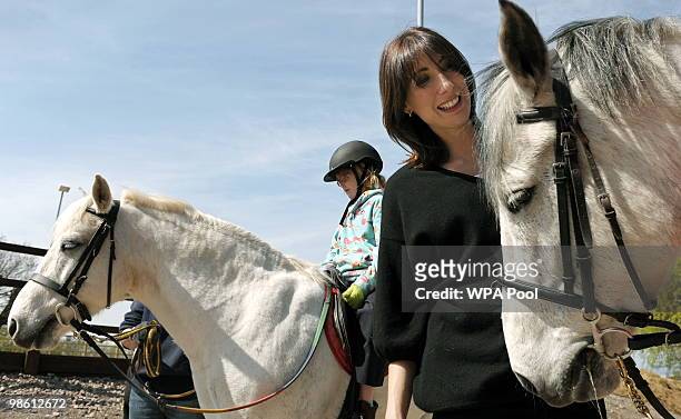 Samantha Cameron , wife of British opposition Conservative party leader David Cameron, pats a horse during an election campaign visit to The Avon...