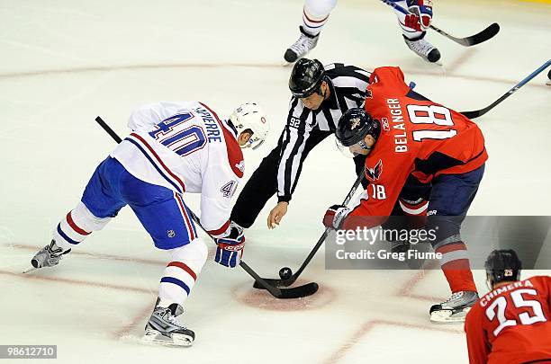 Eric Belanger of the Washington Capitals takes a face off against Maxim Lapierre of the Montreal Canadiens in Game One of the Eastern Conference...